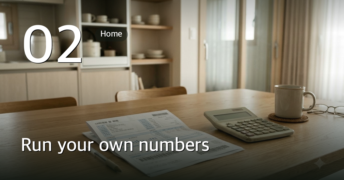 A utility bill and a calculator on a kitchen table